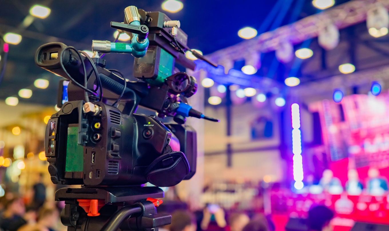 An image of production camera recording a meeting conference