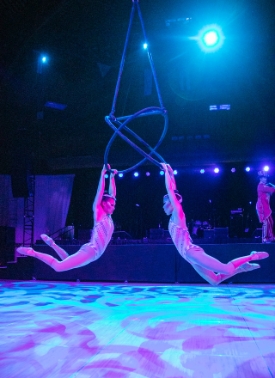 Two woman performing circus
